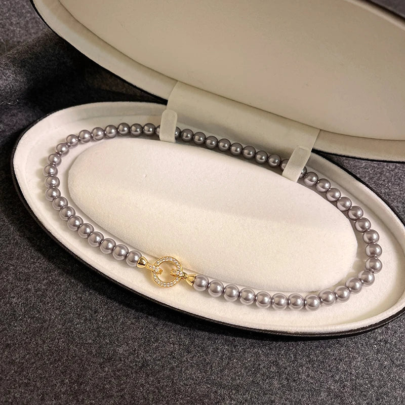 Collar con cierre de anilla y perlas